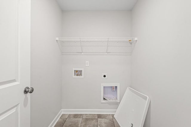 washroom featuring washer hookup, light tile patterned flooring, and hookup for an electric dryer