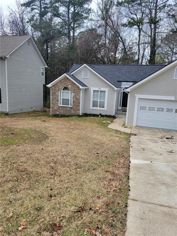 ranch-style home featuring a garage, driveway, stone siding, stucco siding, and a front yard