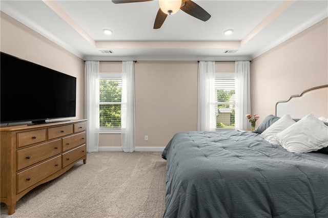508 Windy Ridge Ct, Canton, GA 30114 - bedroom featuring a tray ceiling, light carpet, multiple windows, and ceiling fan