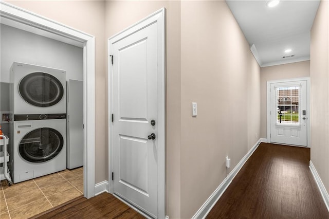 508 Windy Ridge Ct, Canton, GA 30114 - laundry area with stacked washer and clothes dryer, wood finished floors, and recessed lighting