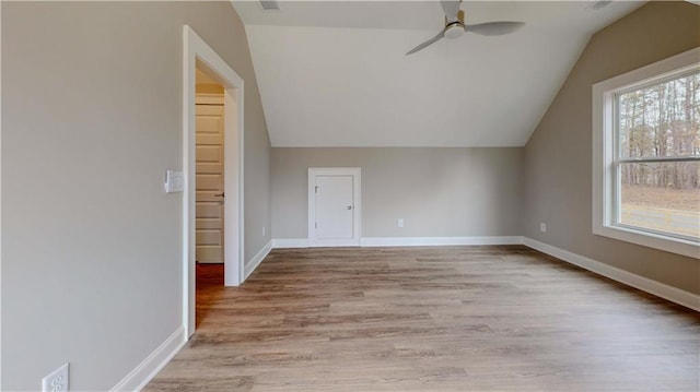 bonus room featuring vaulted ceiling, ceiling fan, and light hardwood / wood-style flooring