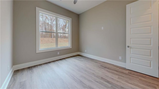 spare room featuring light hardwood / wood-style flooring