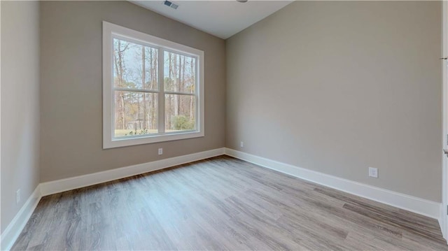 empty room with light hardwood / wood-style floors