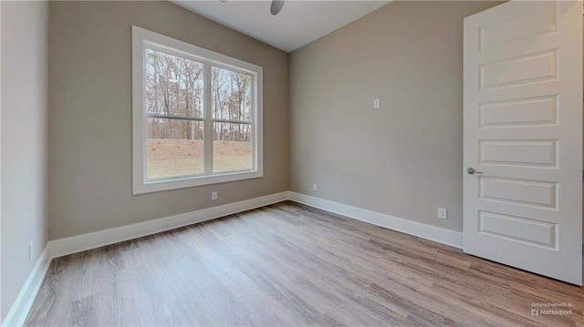 unfurnished room with light hardwood / wood-style floors and ceiling fan