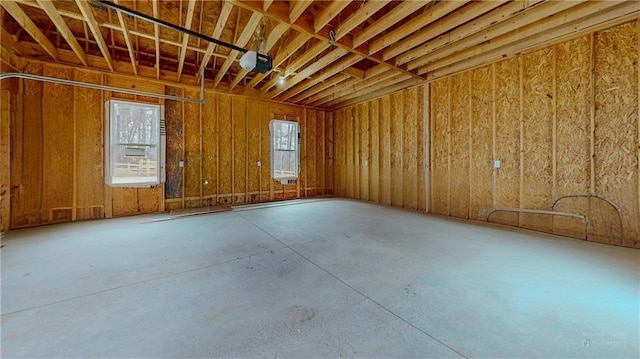 misc room with concrete flooring