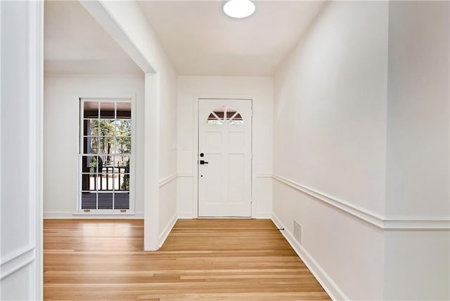 doorway with light hardwood / wood-style flooring