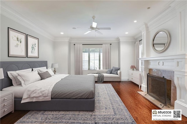 bedroom with dark hardwood / wood-style floors, ceiling fan, and ornamental molding