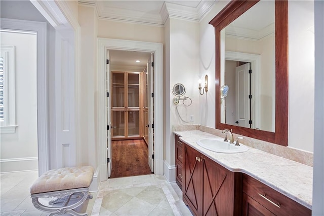 bathroom featuring vanity and ornamental molding