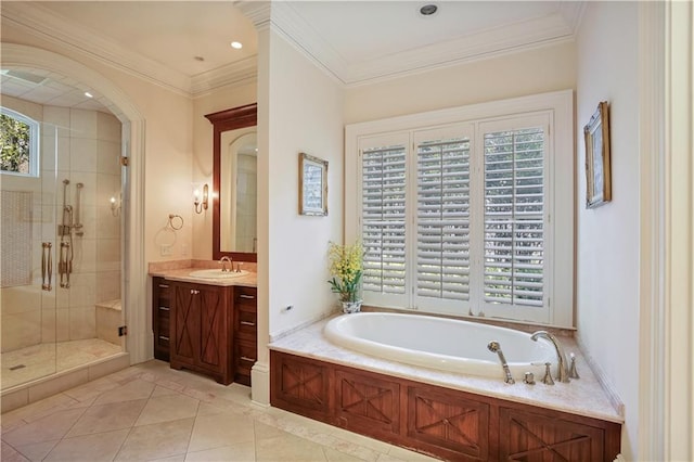 bathroom with tile patterned flooring, vanity, a wealth of natural light, and independent shower and bath