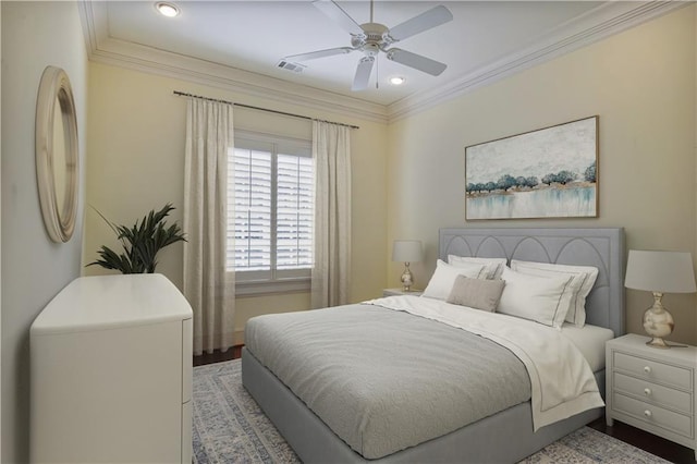 bedroom featuring wood-type flooring, ceiling fan, and ornamental molding