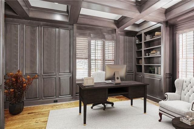 office featuring built in shelves, plenty of natural light, and coffered ceiling