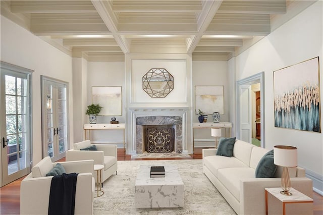 living room with beamed ceiling, hardwood / wood-style floors, a fireplace, and french doors