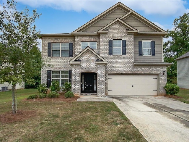 craftsman-style home with a garage, a front yard, concrete driveway, and brick siding