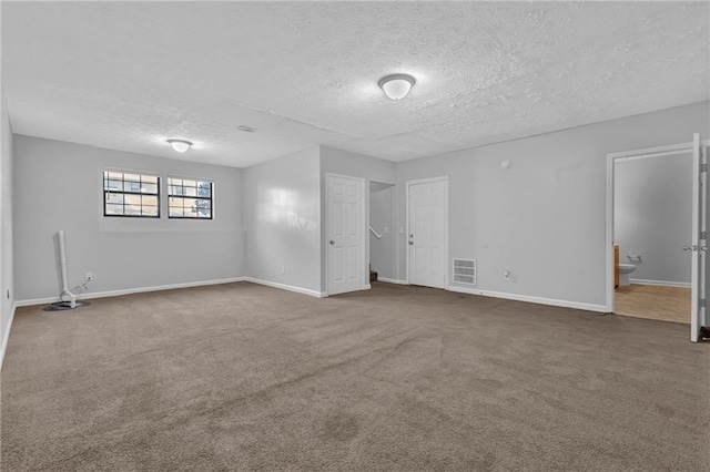 2044 Teal Cv, Lithonia, GA 30058 - interior space featuring carpet flooring, a textured ceiling, visible vents, and baseboards