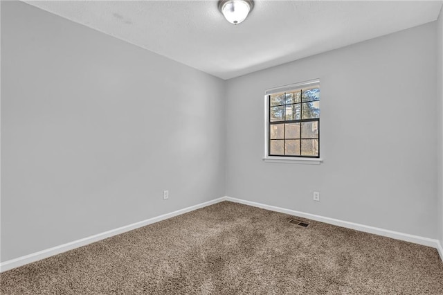 2044 Teal Cv, Lithonia, GA 30058 - empty room with visible vents, carpet flooring, and baseboards