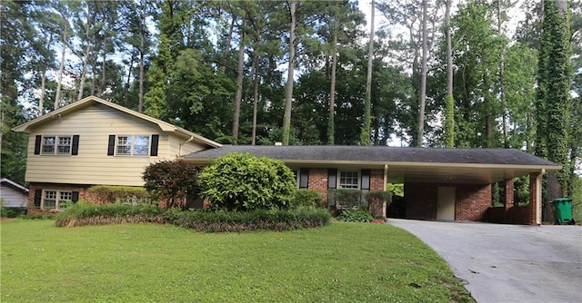 tri-level home featuring a front lawn and a carport