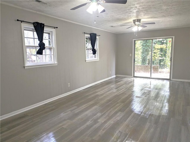 unfurnished room with hardwood / wood-style flooring, ceiling fan, and plenty of natural light