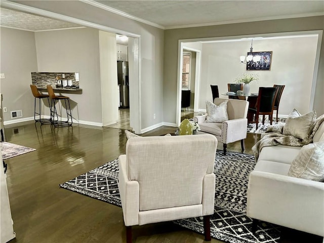 living room featuring a chandelier, crown molding, a textured ceiling, and dark hardwood / wood-style flooring