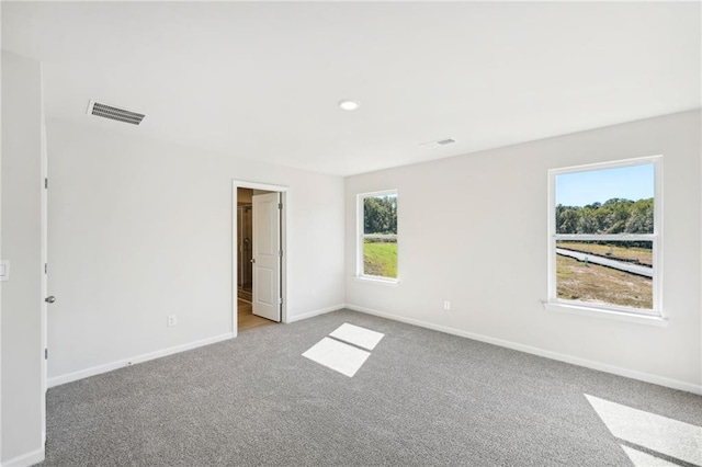 empty room with light colored carpet