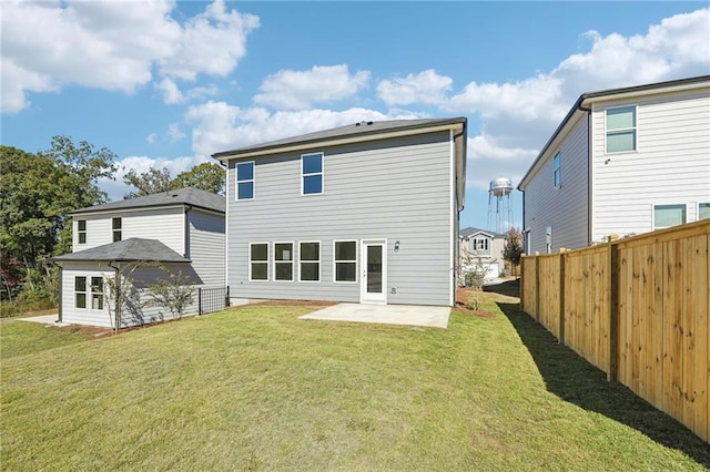 rear view of property with a patio area and a lawn