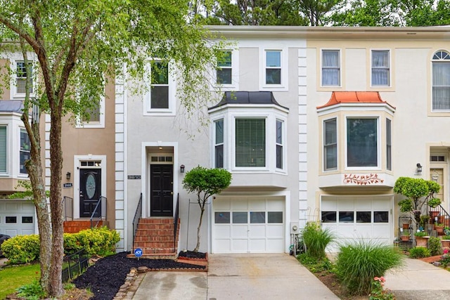 3910 Meeting St, Duluth, GA 30096 - view of property with an attached garage, stucco siding, and driveway