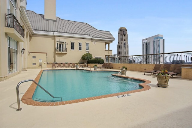 3334 Peachtree Rd NE Unit 101, Atlanta, GA 30326 - community pool featuring a patio area