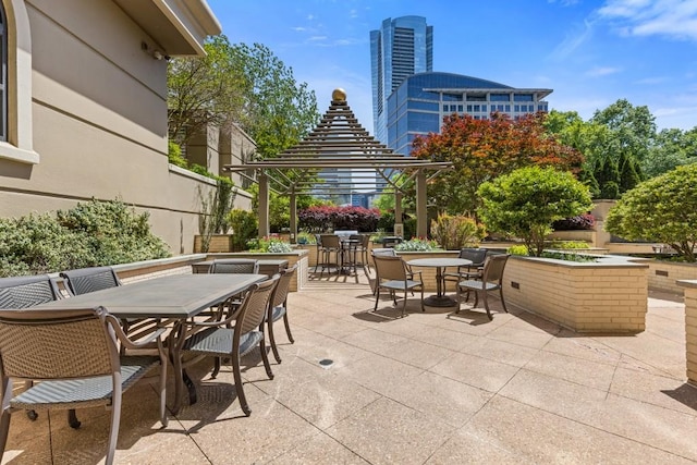 3334 Peachtree Rd NE Unit 101, Atlanta, GA 30326 - view of patio / terrace with outdoor dining space and a gazebo