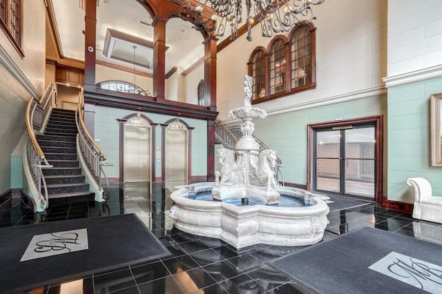 3334 Peachtree Rd NE Unit 101, Atlanta, GA 30326 - common area featuring a towering ceiling and stairs
