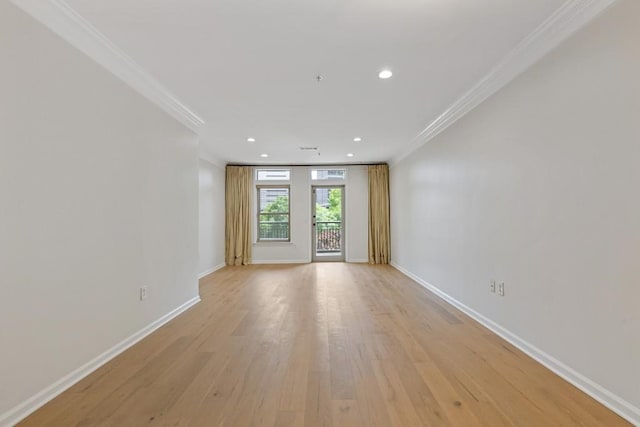 3334 Peachtree Rd NE Unit 101, Atlanta, GA 30326 - empty room with crown molding, baseboards, light wood-style flooring, and recessed lighting
