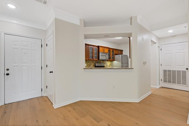3334 Peachtree Rd NE Unit 101, Atlanta, GA 30326 - entrance foyer with light wood-style flooring, crown molding, baseboards, and recessed lighting