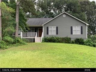 251 Lambeth Dr, Hiram, GA 30141 - ranch-style home featuring a front lawn and a deck