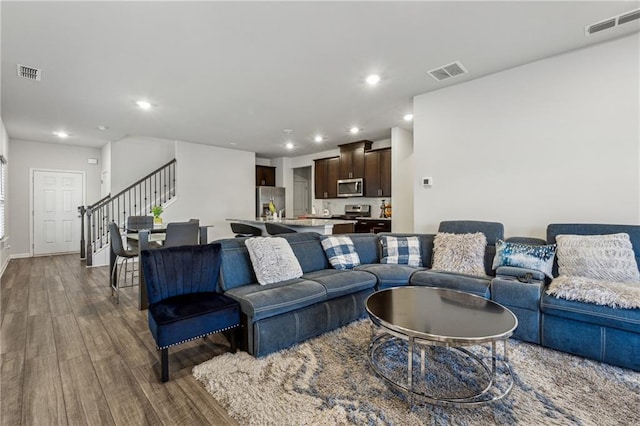 living room featuring dark hardwood / wood-style floors