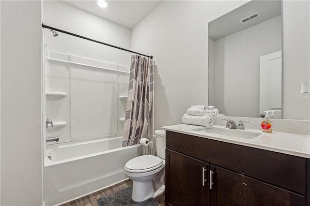 full bathroom with vanity, hardwood / wood-style floors, shower / bathtub combination with curtain, and toilet