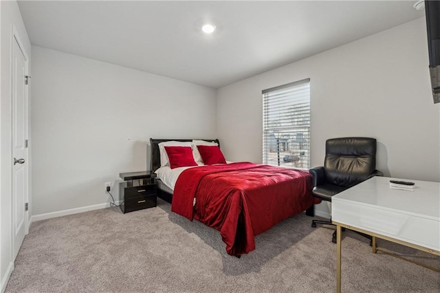 bedroom with light carpet