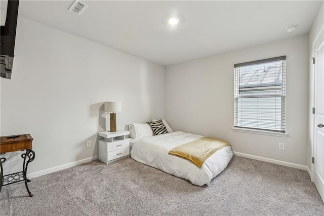 bedroom featuring light carpet