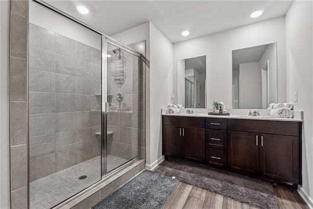 bathroom with vanity and an enclosed shower