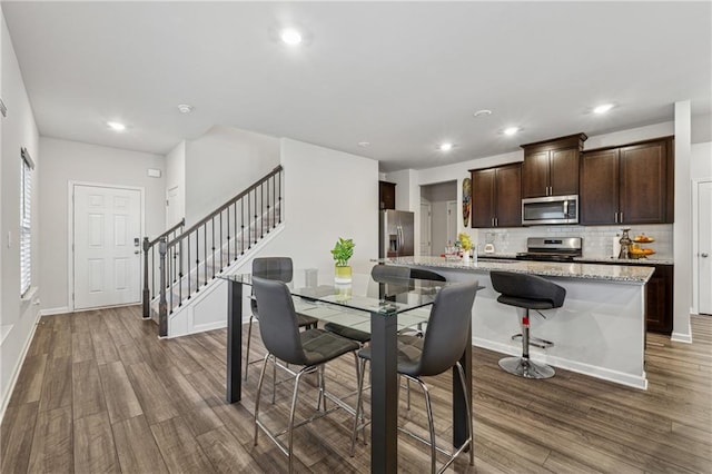 dining room featuring wood-type flooring