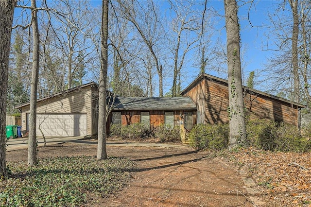 view of property exterior with a garage