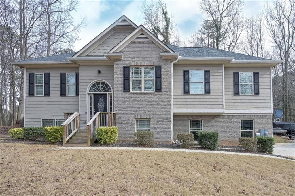 bi-level home with a front yard