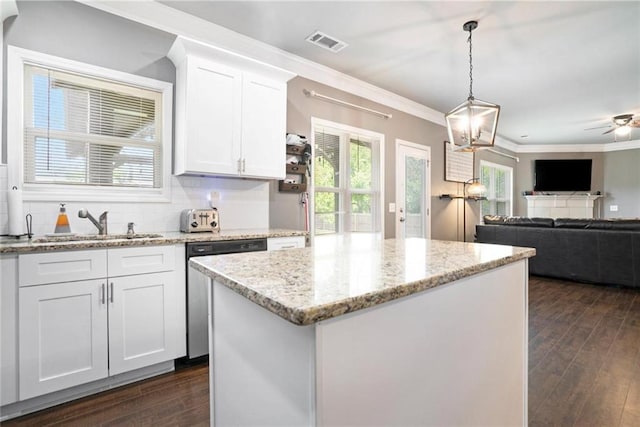 kitchen featuring dishwasher, dark wood finished floors, white cabinets, ceiling fan, and pendant lighting