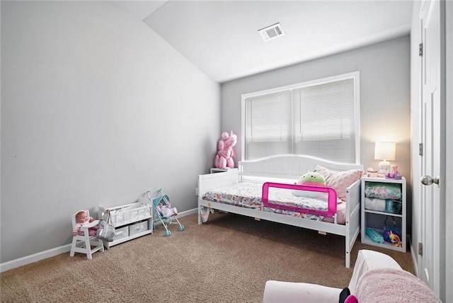 carpeted bedroom with vaulted ceiling and baseboards