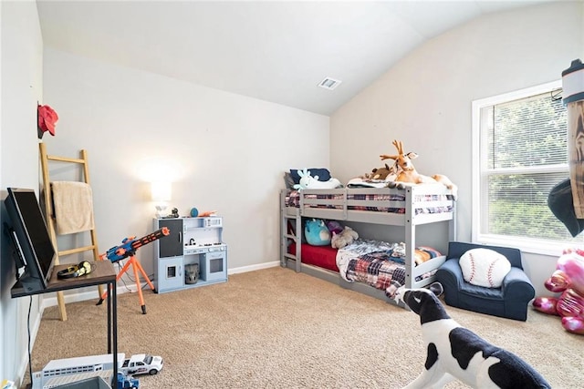 bedroom with carpet flooring and vaulted ceiling