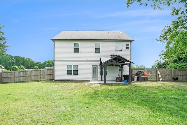back of property featuring a gazebo and a patio