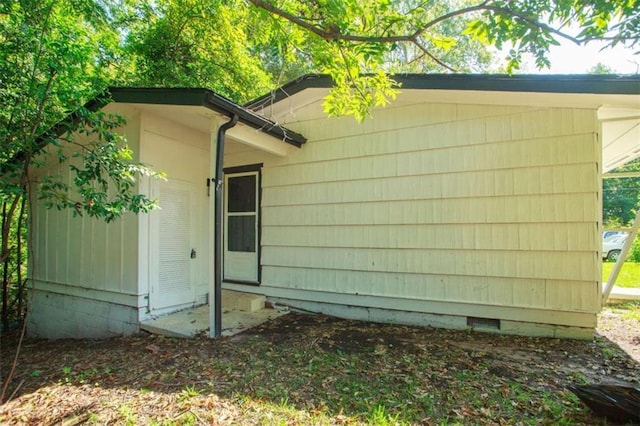 view of property exterior featuring crawl space