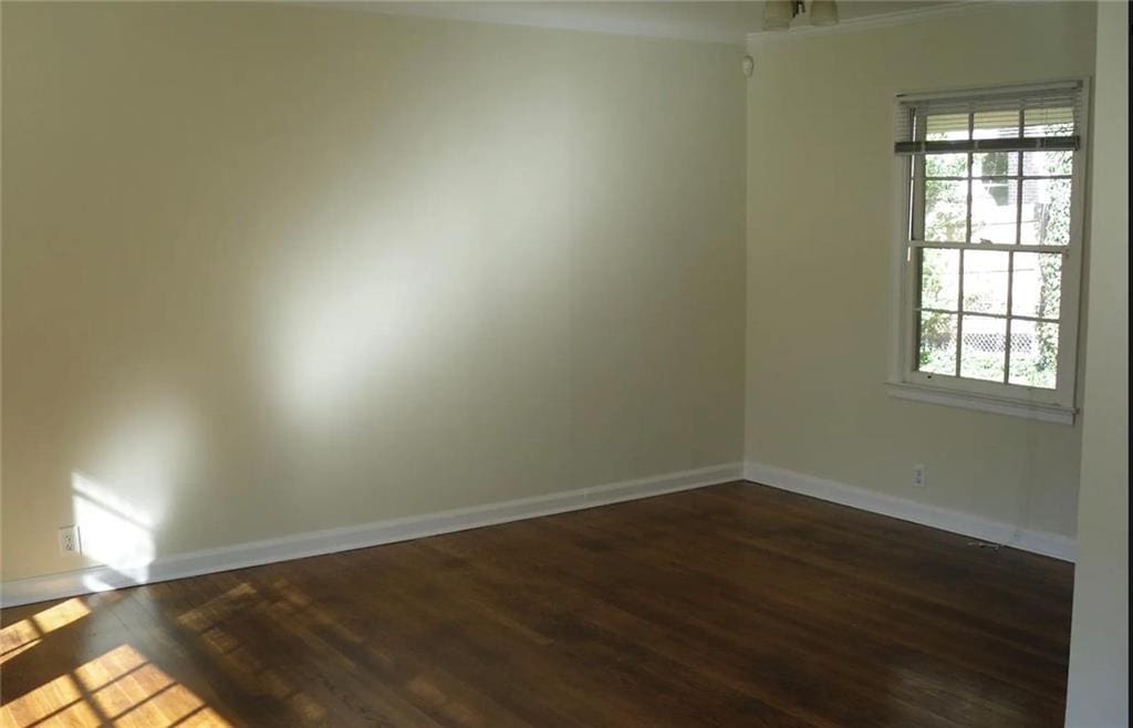 1253 Dunwoody Ln NE, Brookhaven, GA 30319 - empty room with baseboards, healthy amount of natural light, and dark wood finished floors