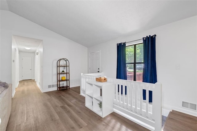4771 N Springs Rd NW, Kennesaw, GA 30144 - bedroom with lofted ceiling, wood finished floors, and baseboards