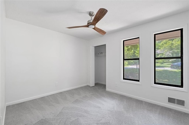 4771 N Springs Rd NW, Kennesaw, GA 30144 - unfurnished bedroom featuring light carpet, baseboards, a closet, and a ceiling fan