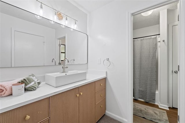 4771 N Springs Rd NW, Kennesaw, GA 30144 - bathroom featuring vanity, wood finished floors, and a shower with curtain