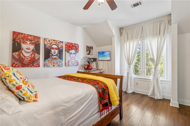 bedroom with dark wood-type flooring, ceiling fan, and vaulted ceiling