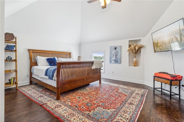 bedroom with high vaulted ceiling, ceiling fan, and dark hardwood / wood-style floors